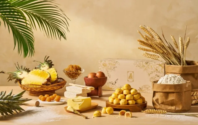 Pineapple, butter and baking ingredients arranged with pineapple balls